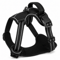 Black dog harness with reflective stripes on a white background