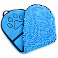 Blue grooming mitt with a paw print design on a white background
